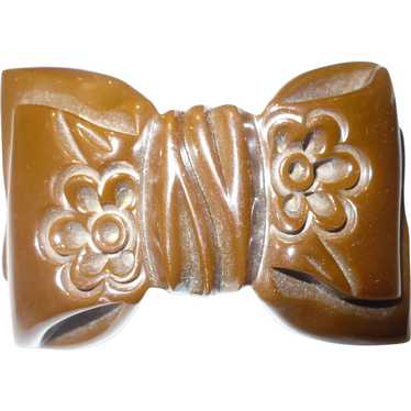 Carved Brown Bakelite Bow Pin