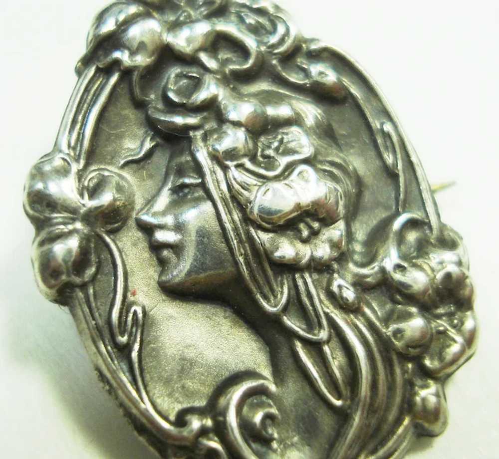 Pair of Art Nouveau Sterling Repousse Lady Pins - image 4