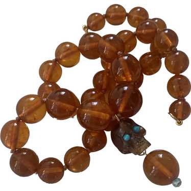 Natural Baltic Amber Bead & carved skull