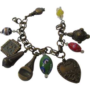 Vintage Bronze Tone Charm Bracelet With a Variety 