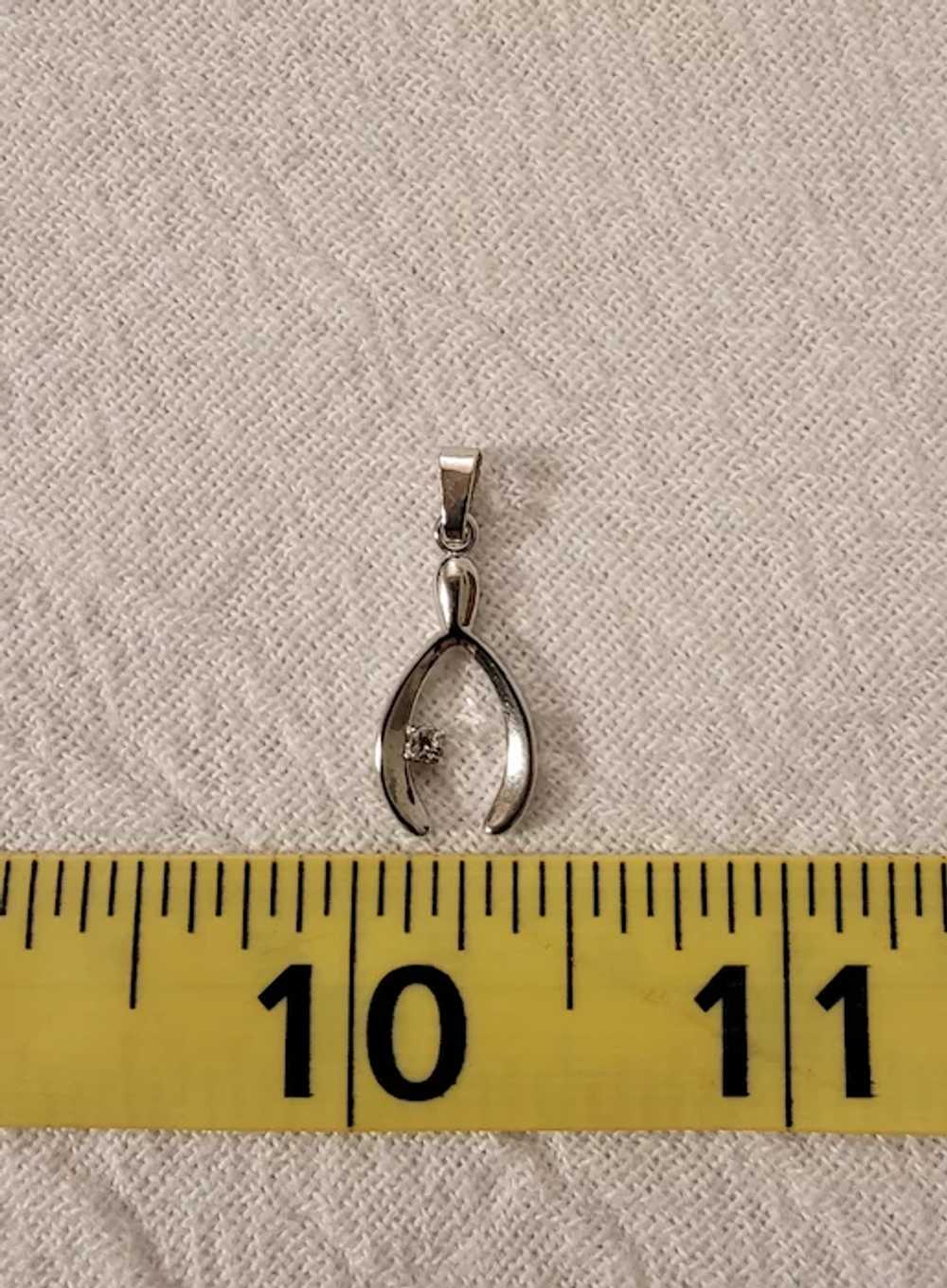 Small silver tone wishbone pendant with rhinestone - image 2