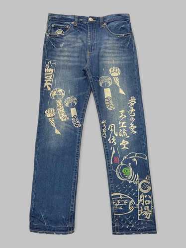 Blue denim trousers with Notte Giorno print