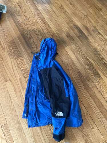 The North Face Blue and black north face wind brea