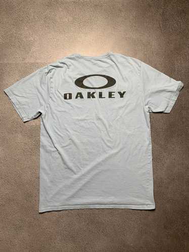 OAKLEY Camiseta masculina cinza mescla estampa preta caveira G - Second  Hand / Brecho