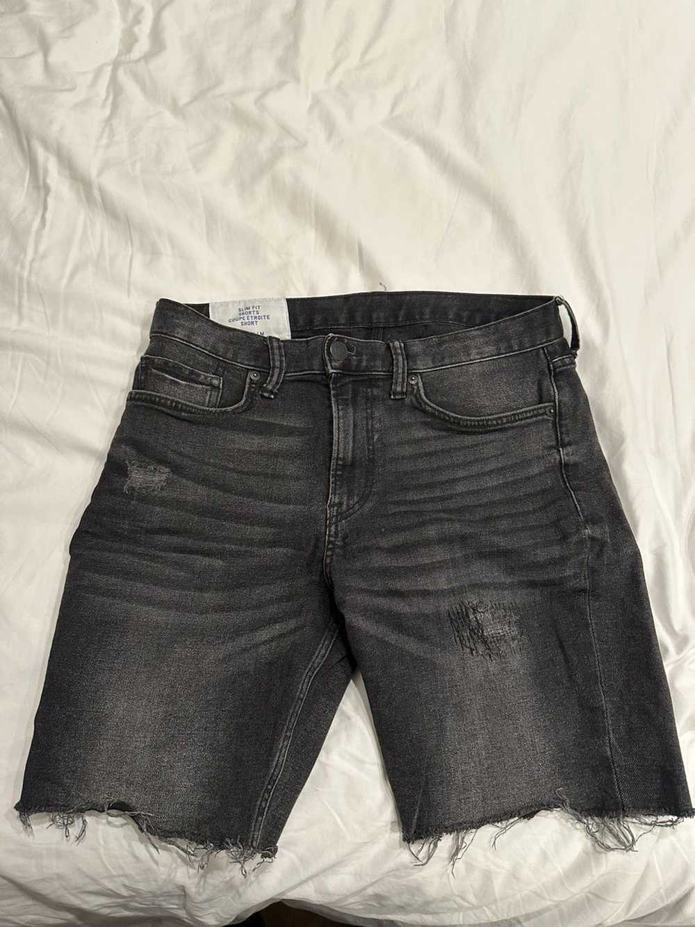 Designer Black ripped jean shorts - image 1