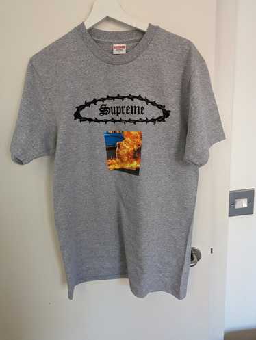 Supreme burning outlet man tee