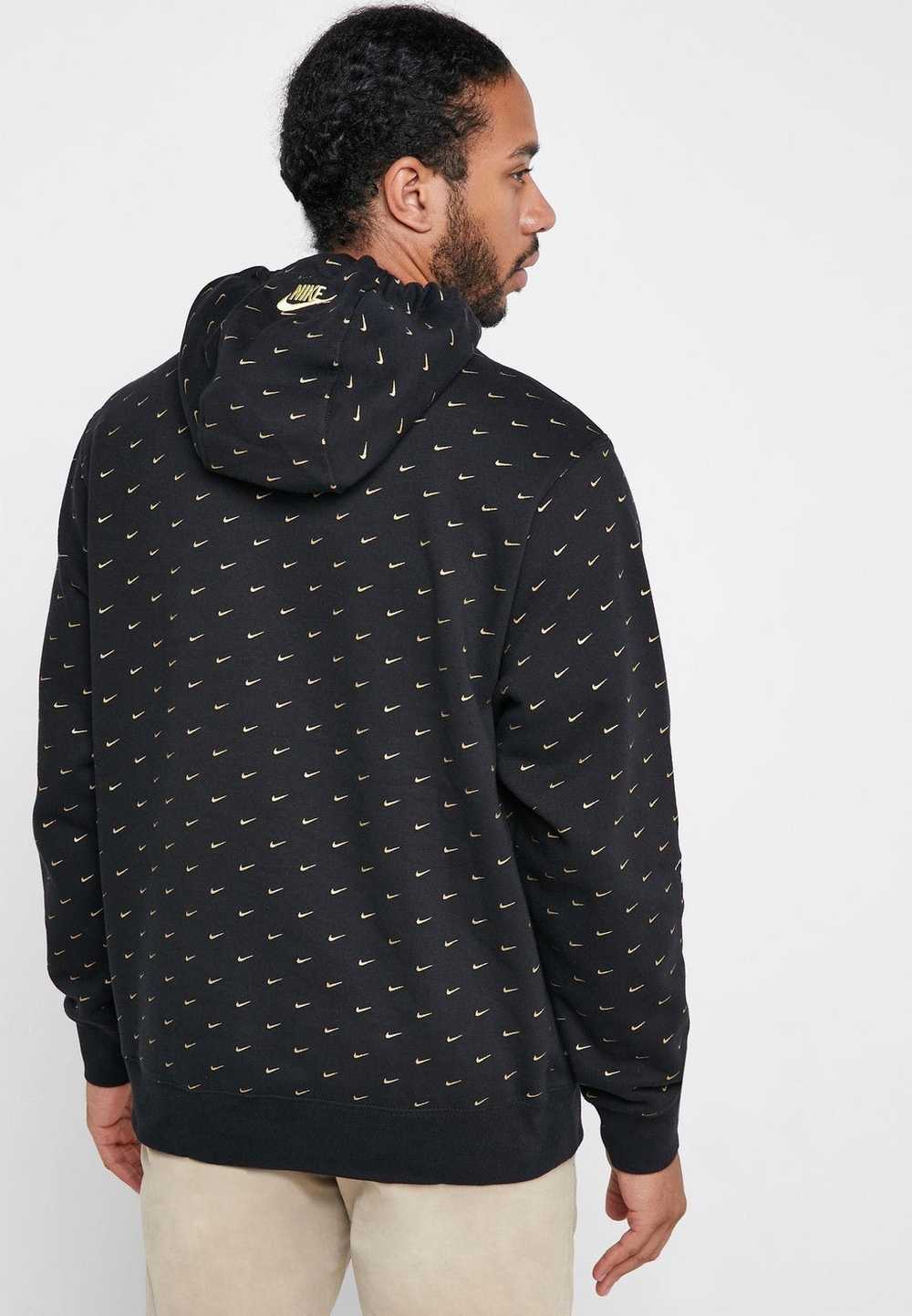 black and gold nike swoosh