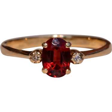 Garnet and Diamond Three Stone Ring In Yellow Gold