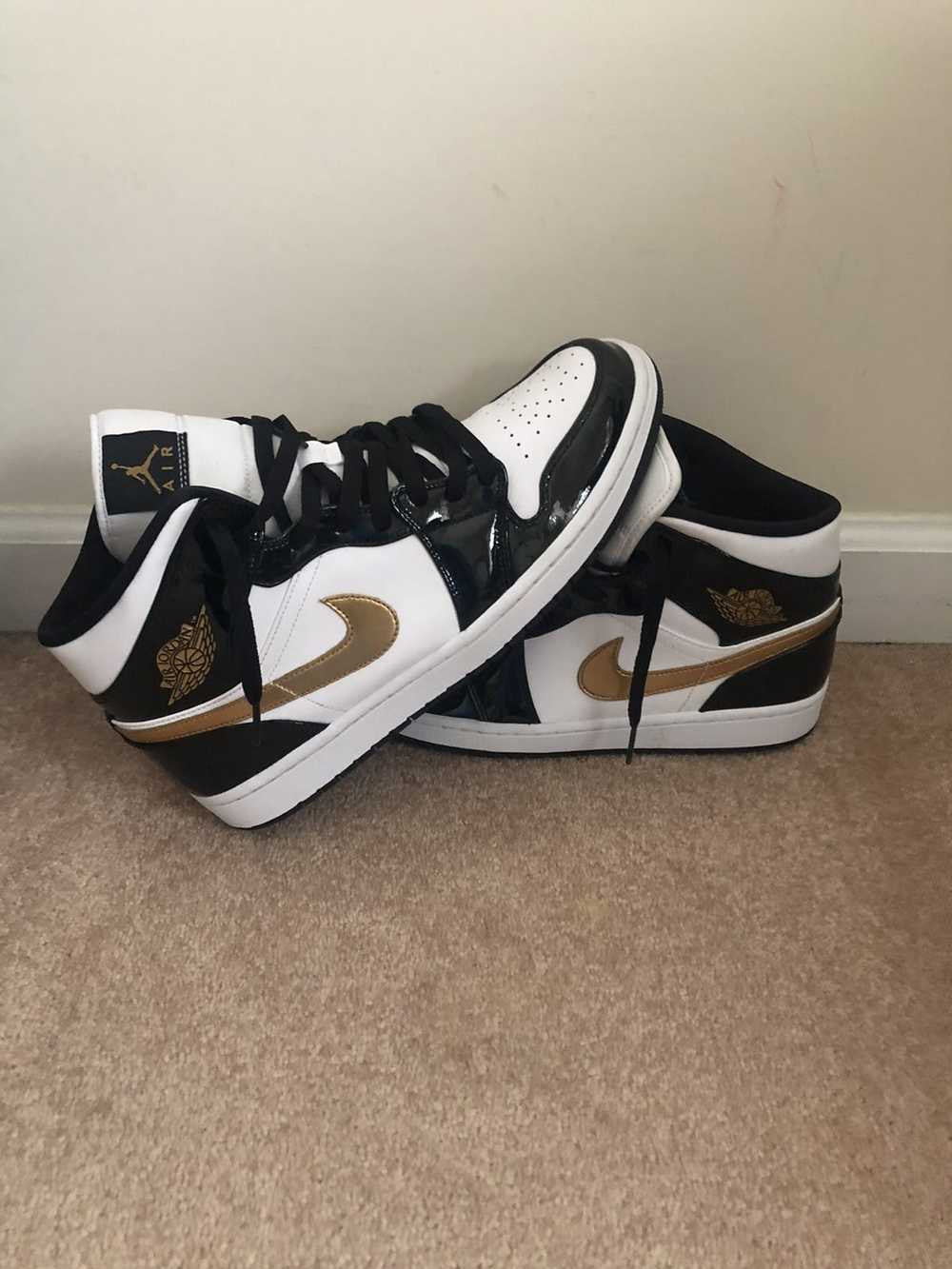 Jordan Brand Air Jordan 1 Mid Patent Black Gold - image 1