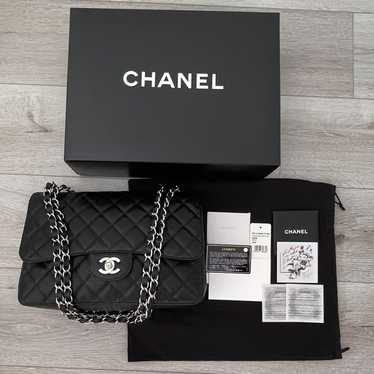 Chanel Jumbo classic flap bag black caviar with silver hardware, black  leather moto jacket with oversized gray scarf and skirt winter oufit, how  to layer with a leather jacket - Meagan's Moda