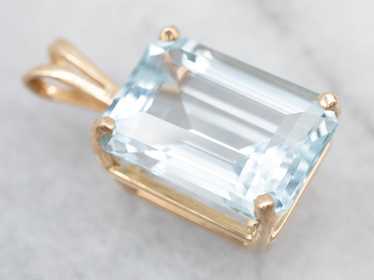 Yellow Gold Blue Topaz Solitaire Pendant - image 1