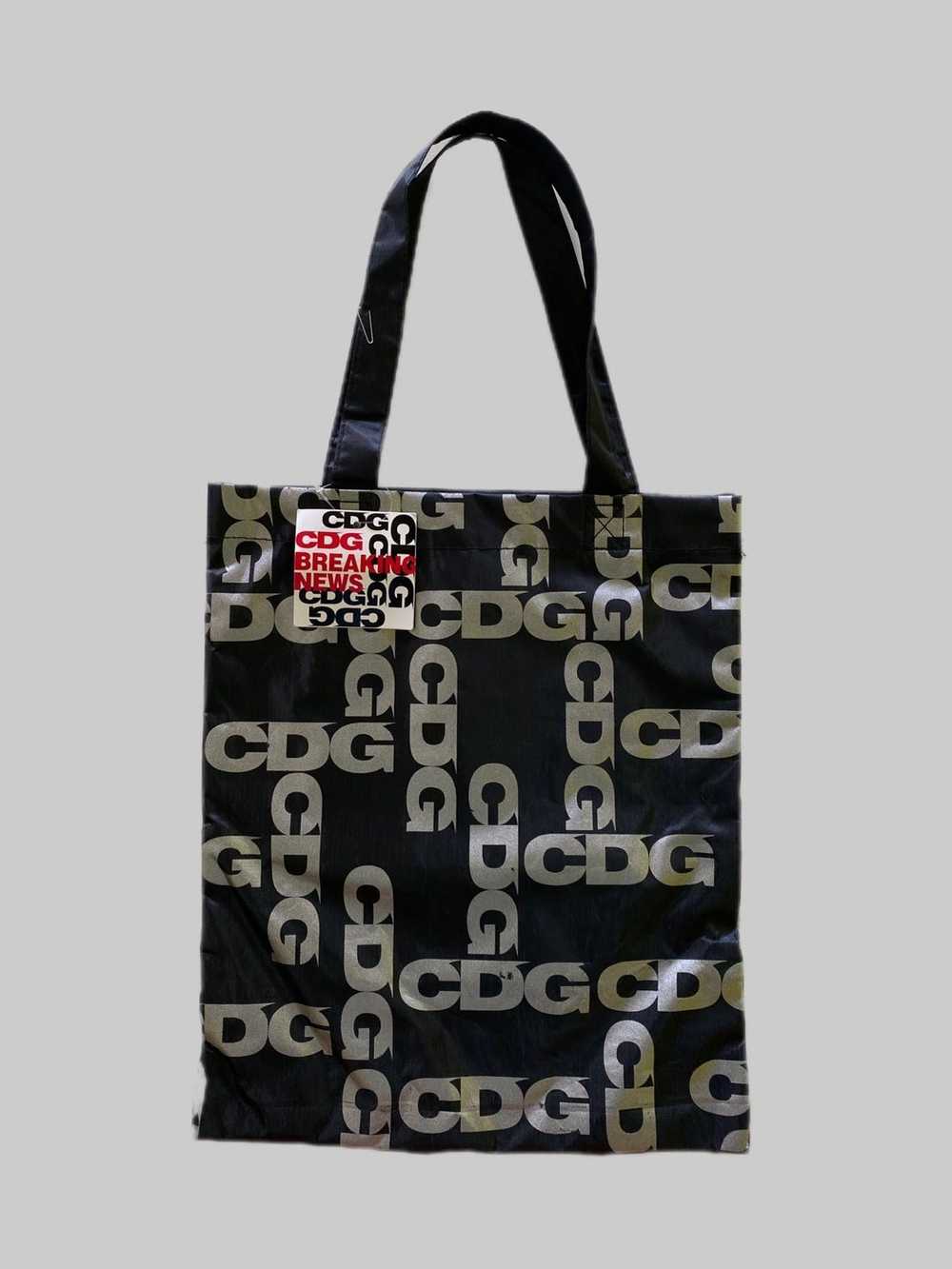 CDG CDG CDG × Comme des Garcons CDG Breaking News… - image 1