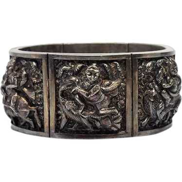 Antique silver Buddhist Gods with animals repousse