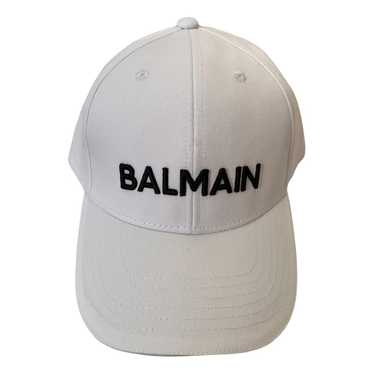 Blogger MiaMiaMine wearing Balmain Blazer, Blank Denim Leather Pants, and  baseball cap for spring at MiaMiaM…