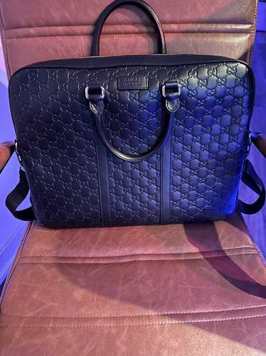 Gucci Gucci GG Embossed Leather Briefcase.