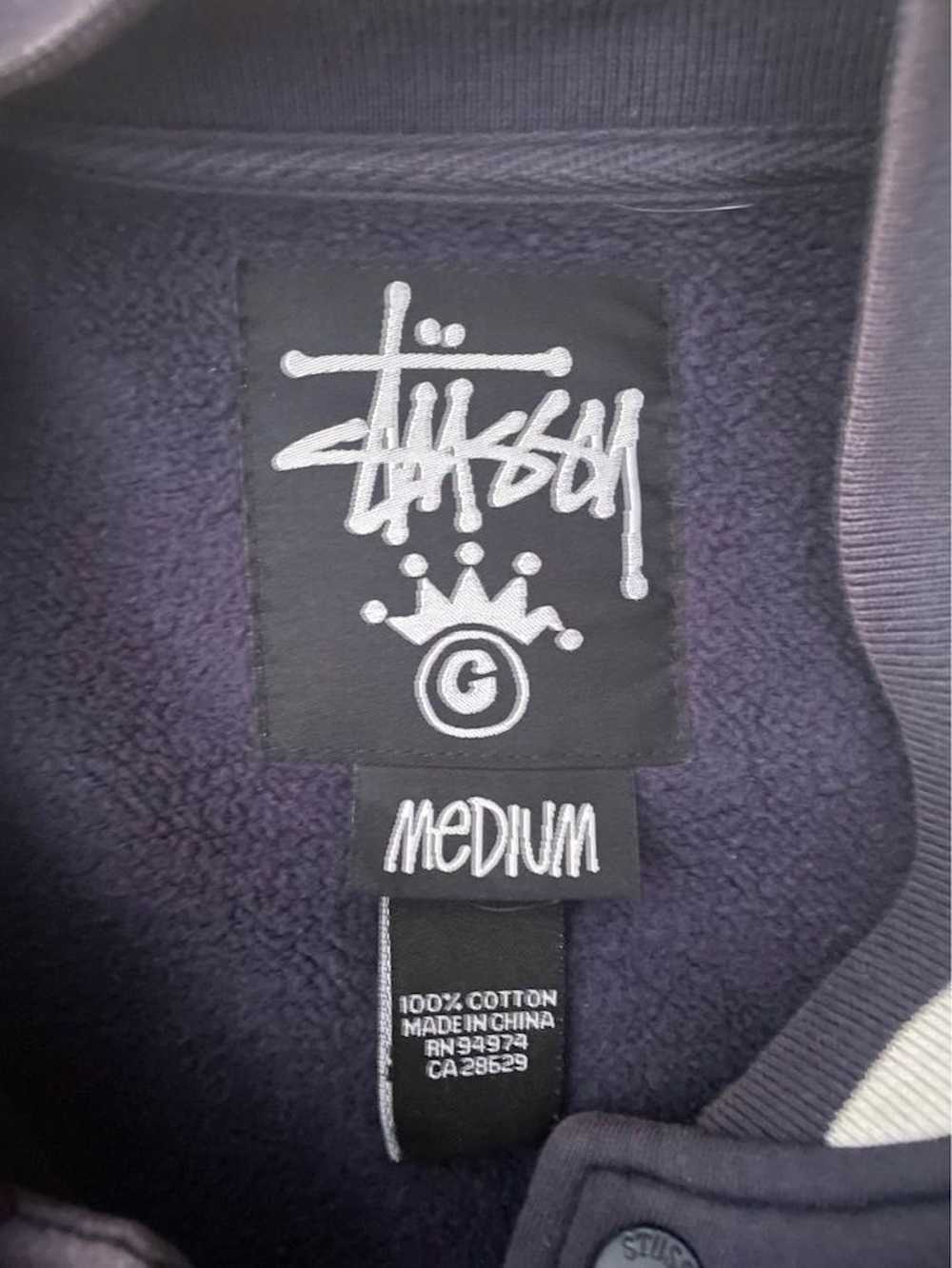 stussy world tour varsity jacket