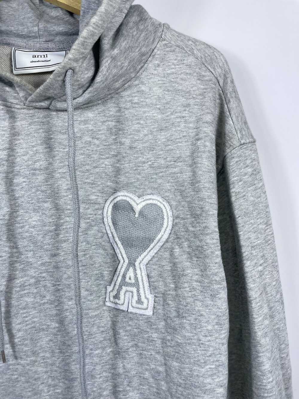 ★関税込★AMI★AMI SMALL HEART LOGO HOODIE★GRAY AMI Heart Logo Hoodie Heather Grey at CareOfCarl.com