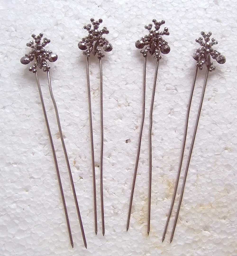 Set of four late Victorian cut steel hair pins th… - image 3