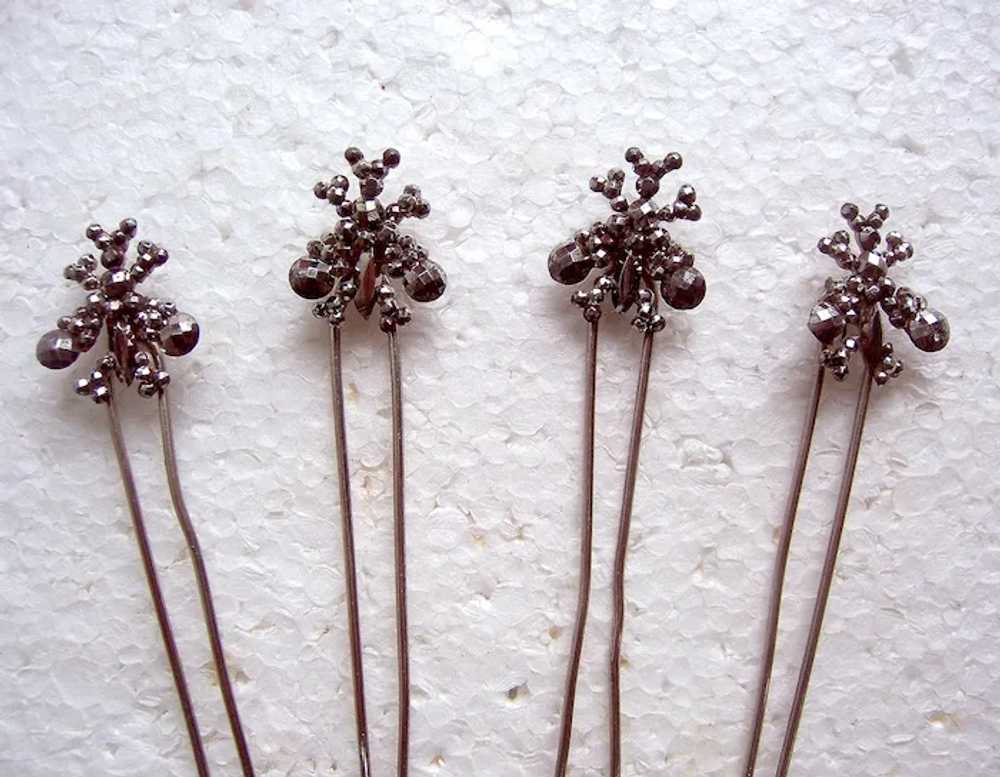 Set of four late Victorian cut steel hair pins th… - image 4