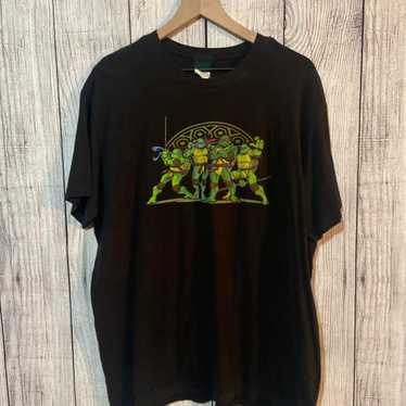 https://img.gem.app/886095179/1t/1701037664/ninja-turtles-shirt.jpg