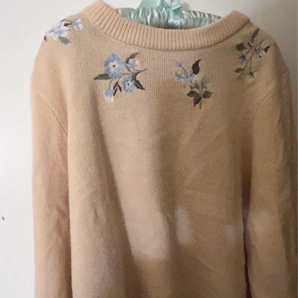 cream sweater with a light blue floral design - image 1