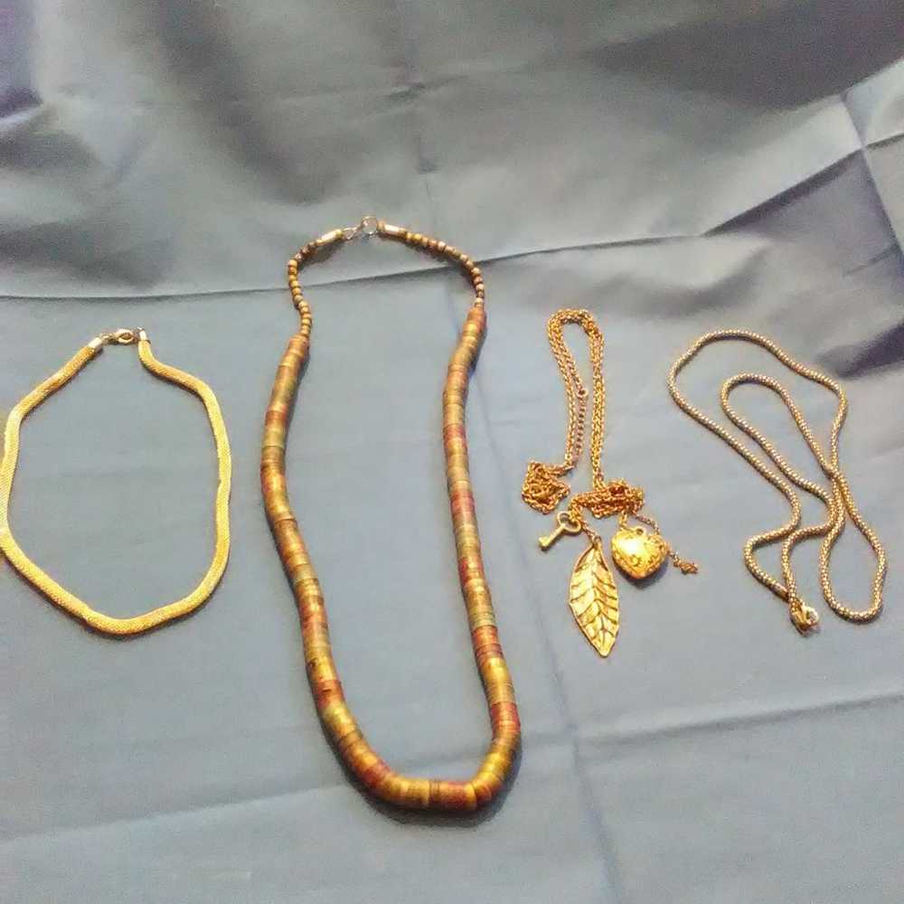 4 different unmarked metal necklaces - image 1