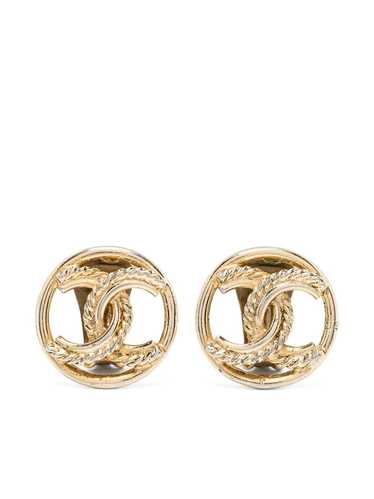 Chanel Pre-Owned 1970s twisted edge rhinestone cuff links - Gold