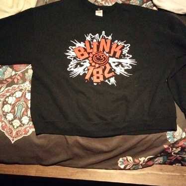 I am showing a blink-182 sweater - image 1