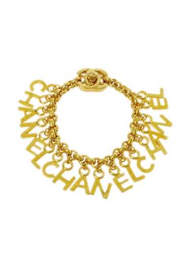 CHANEL Pre-Owned 1996 Turnlock letter charms brac… - image 1