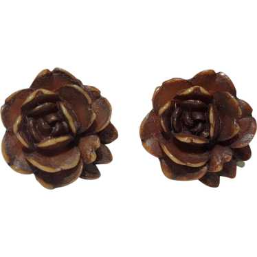 Carved early plastic rose form screw back earrings